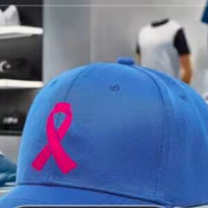 Blue cap with Breast cancer Symbol " ribbon " in red.